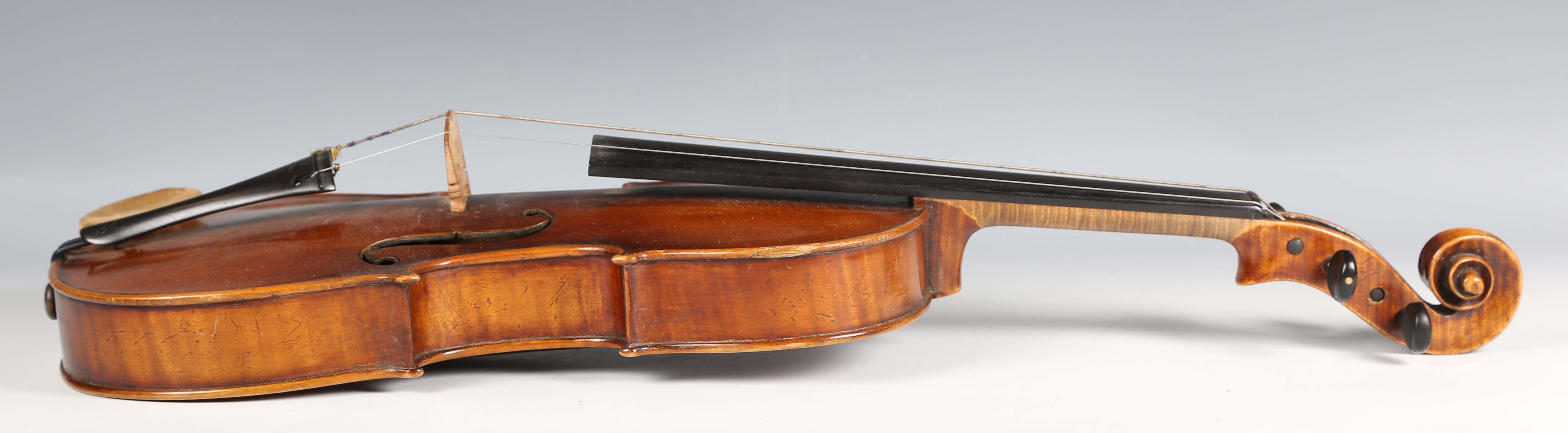 A violin with striped two-piece back, bearing interior label detailed 'Antonius Stradivarius...', - Image 9 of 24