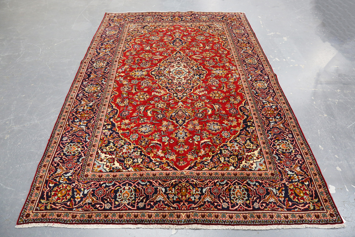 A Kashan carpet, Central Persia, late 20th century, the red field with a shaped medallion, within