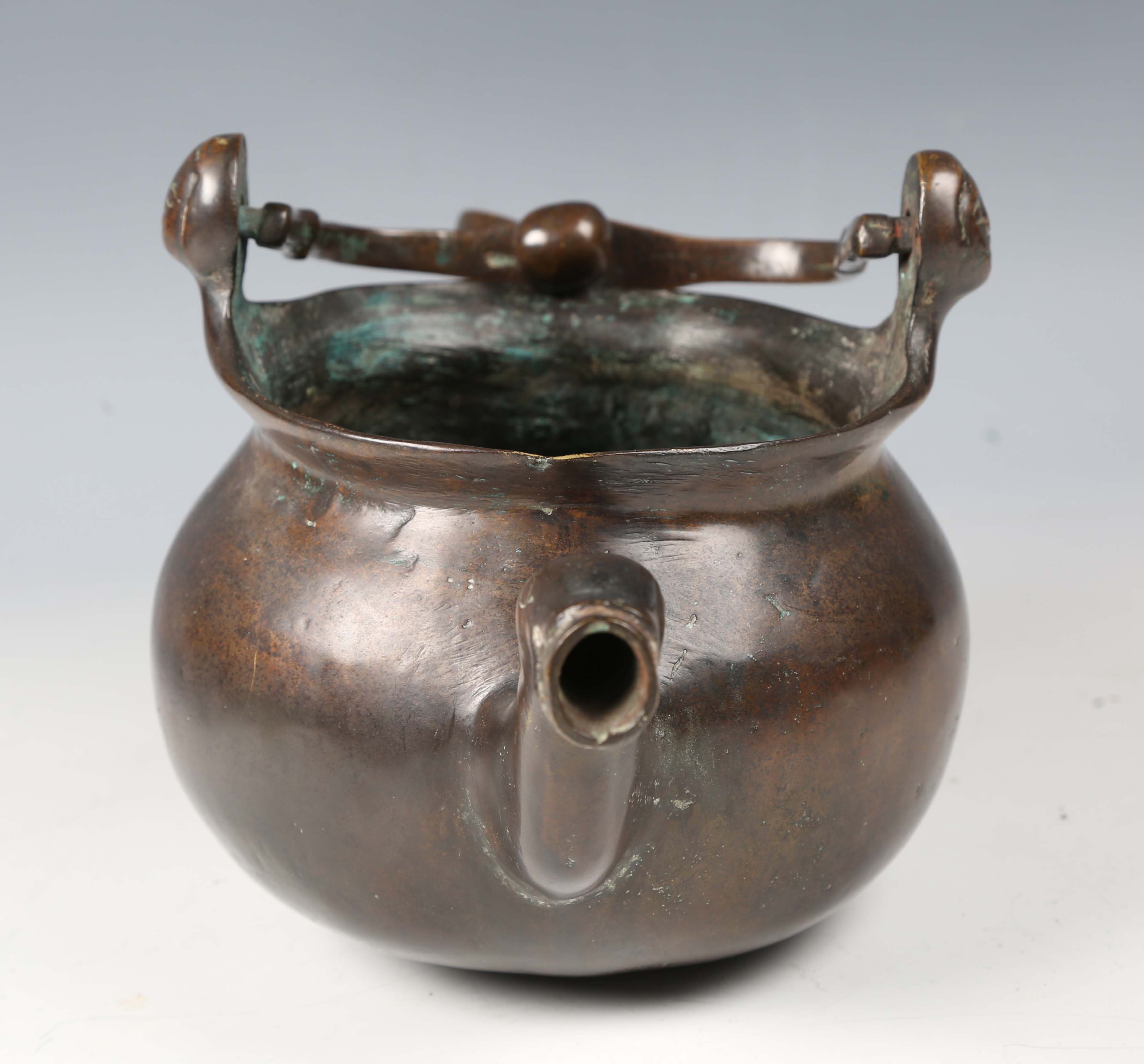 A 16th century Flemish patinated bronze lavabo, the swing handle above two female mask lugs, the - Image 6 of 10