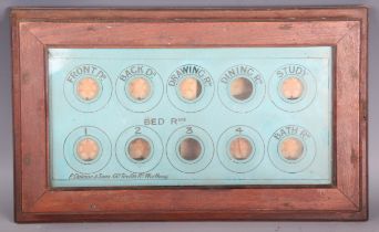 An early/mid-20th century walnut cased servants' room indicator by P. Dalmon & Sons, Worthing, width