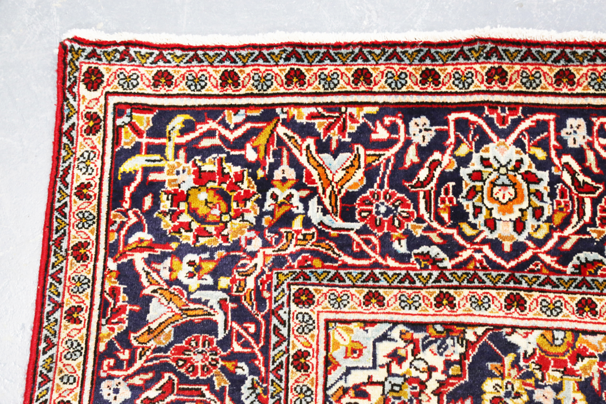 A Kashan carpet, Central Persia, late 20th century, the red field with a shaped medallion, within - Image 4 of 7