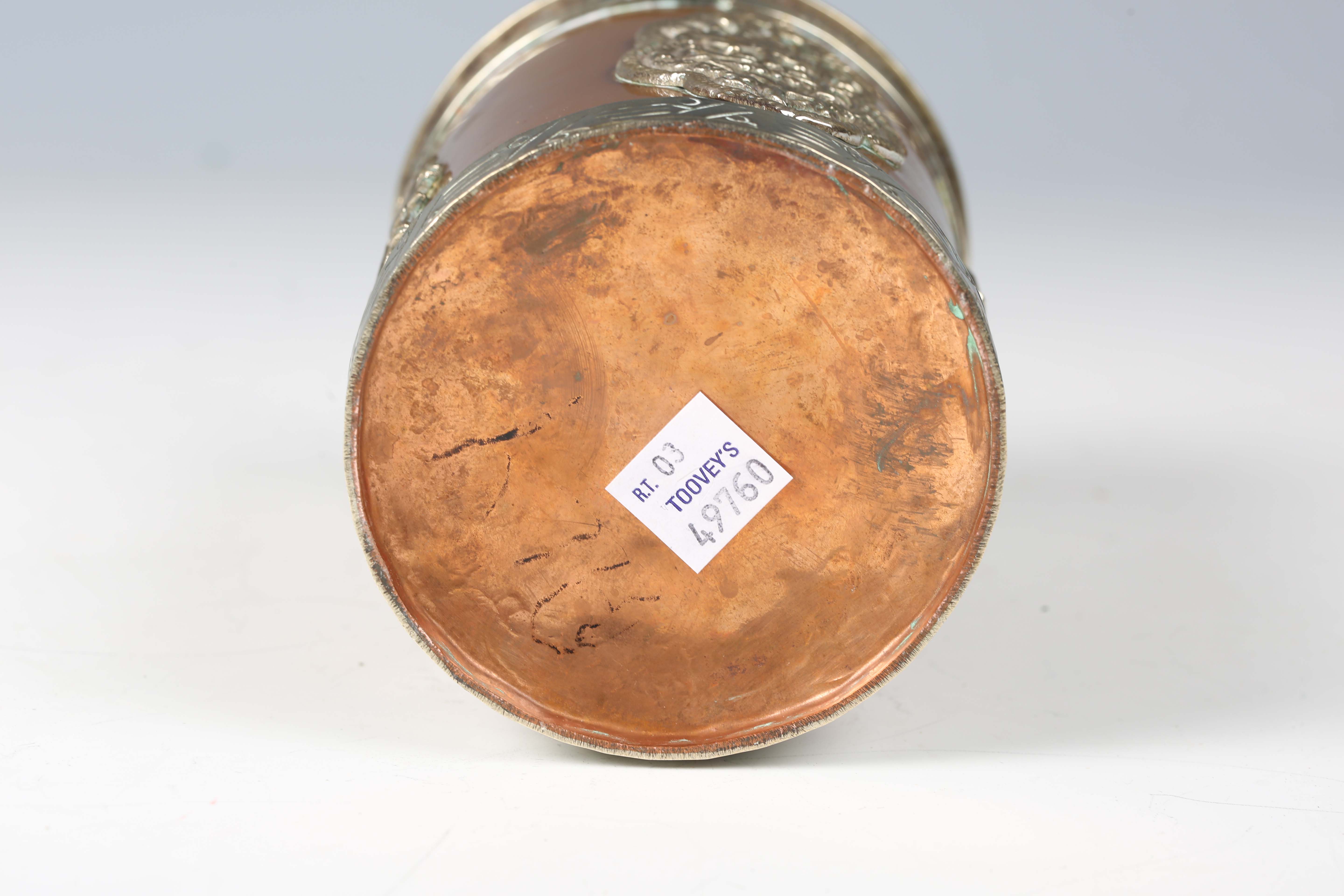 A 20th century Tibetan copper and nickel mounted cylindrical jar and cover, the lid inset with - Image 2 of 8