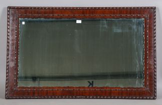 An early 20th century mahogany framed mirror with bead and reel mouldings, 117cm x 72cm.Buyer’s