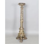 A 17th century Italian silvered and carved softwood torchère, the top fitted with a circular metal