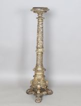 A 17th century Italian silvered and carved softwood torchère, the top fitted with a circular metal