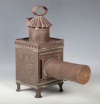 A 19th century French tin magic lantern, probably by Lapierre, height 35cm.Buyer’s Premium 29.4% (