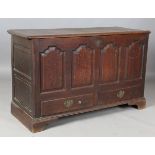 A late George III Lancastrian oak mule chest, the hinged lid above four arched panels and two