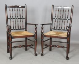 A set of eight modern 18th century provincial style spindle back dining chairs with rush seats,