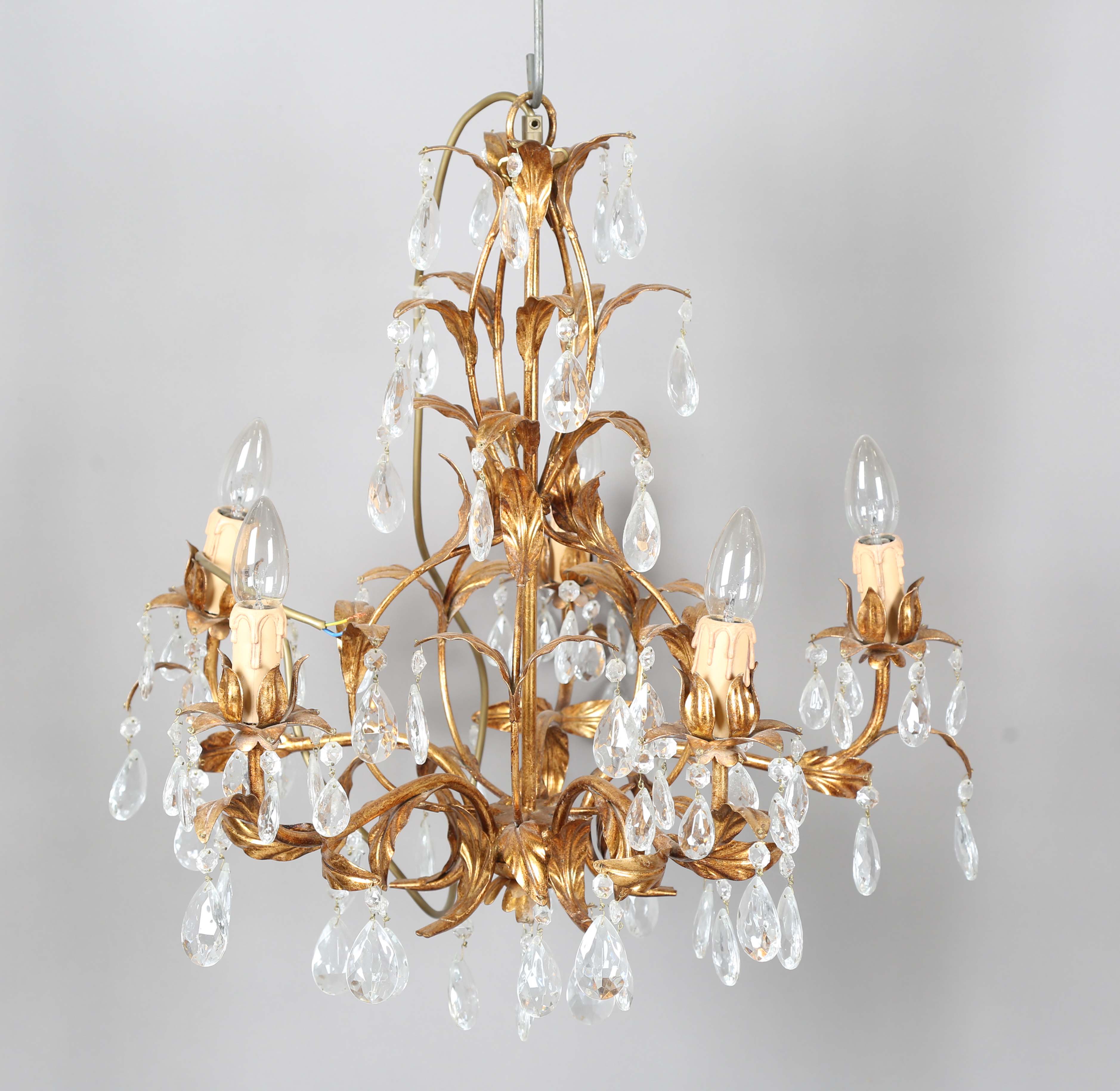A 20th century gilt metal and cut glass five-light chandelier, height 60cm, width 55cm.Buyer’s
