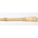 A late 18th/early 19th century carved scrimshaw walking cane, the marine ivory pommel above a carved