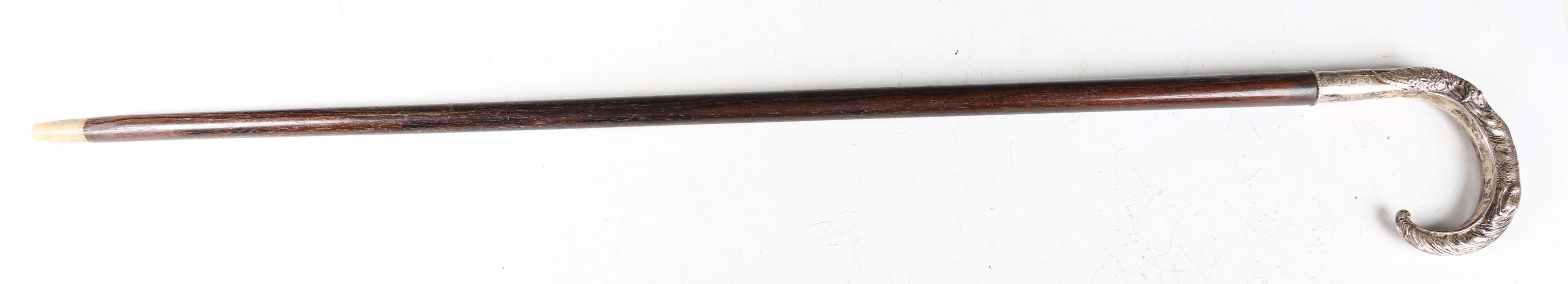 A late 20th century hardwood walking stick, the silver handle decorated in relief with a fox and - Image 3 of 11