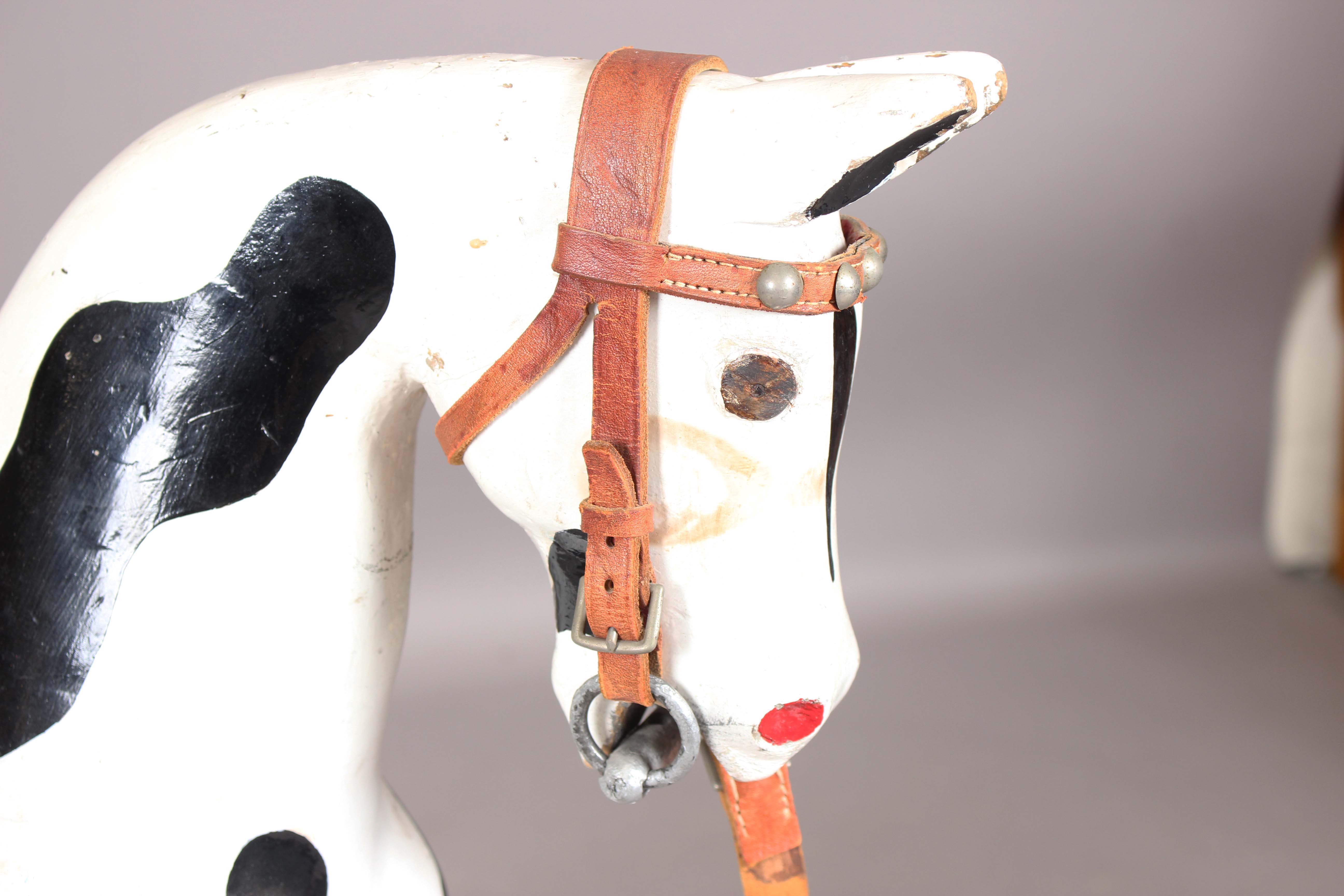 A 19th century carved and painted wooden rocking horse with later leather saddle and pine base, - Image 15 of 15