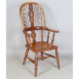 A mid-Victorian yew and elm stick and pierced splat back Windsor armchair with finely carved