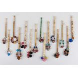 A collection of approximately forty-eight turned bone bobbins, many with engraved names and one