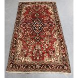 A Borchalue rug, North-west Persia, mid-20th century, the red field with a shaped medallion,