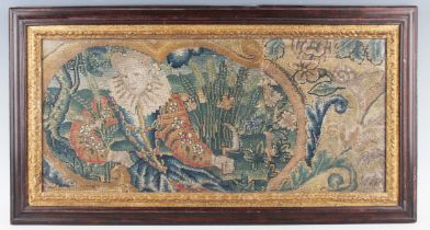 A 17th century woolwork panel, finely worked in coloured wools with a seated Elizabethan lady