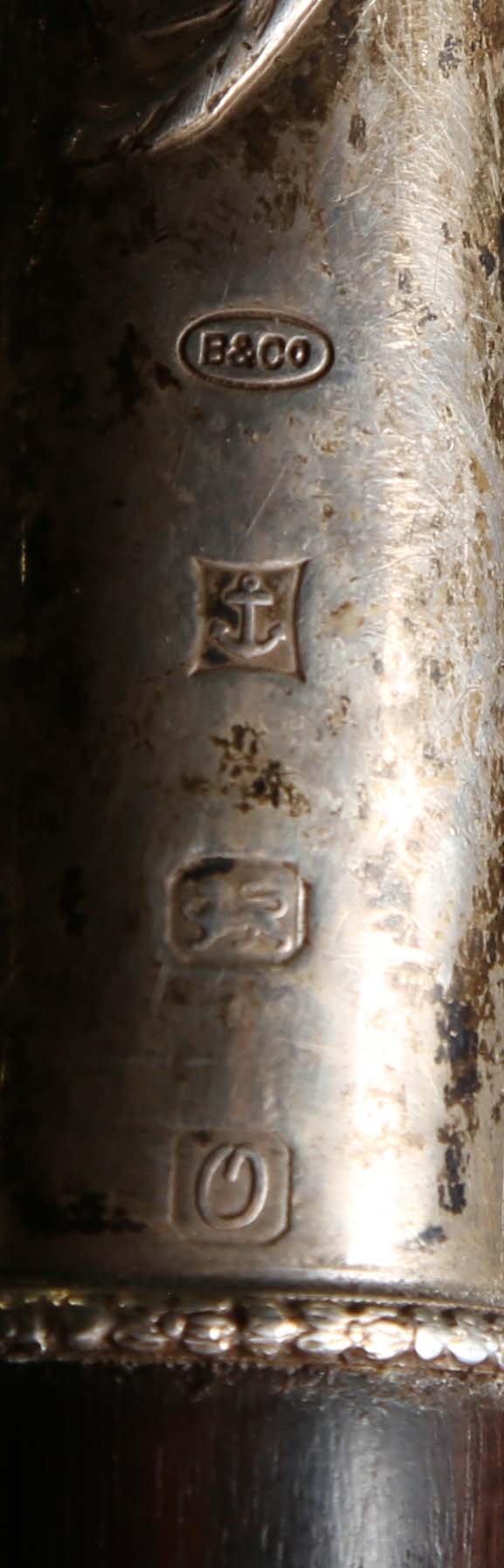 A late 20th century hardwood walking stick, the silver handle decorated in relief with a fox and - Image 2 of 11