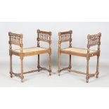 A pair of 20th century French walnut framed window seats with caned seats, height 75cm, width