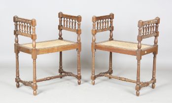 A pair of 20th century French walnut framed window seats with caned seats, height 75cm, width