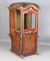 An 18th century North European rococo style giltwood framed and painted leather sedan chair, the