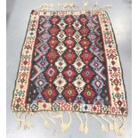 A Turkish kelim rug, late 20th century, the multi-coloured field with horizontal columns of