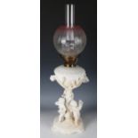 A Victorian Moore Bros white glazed porcelain figural oil lamp with Hinks's Duplex burner and