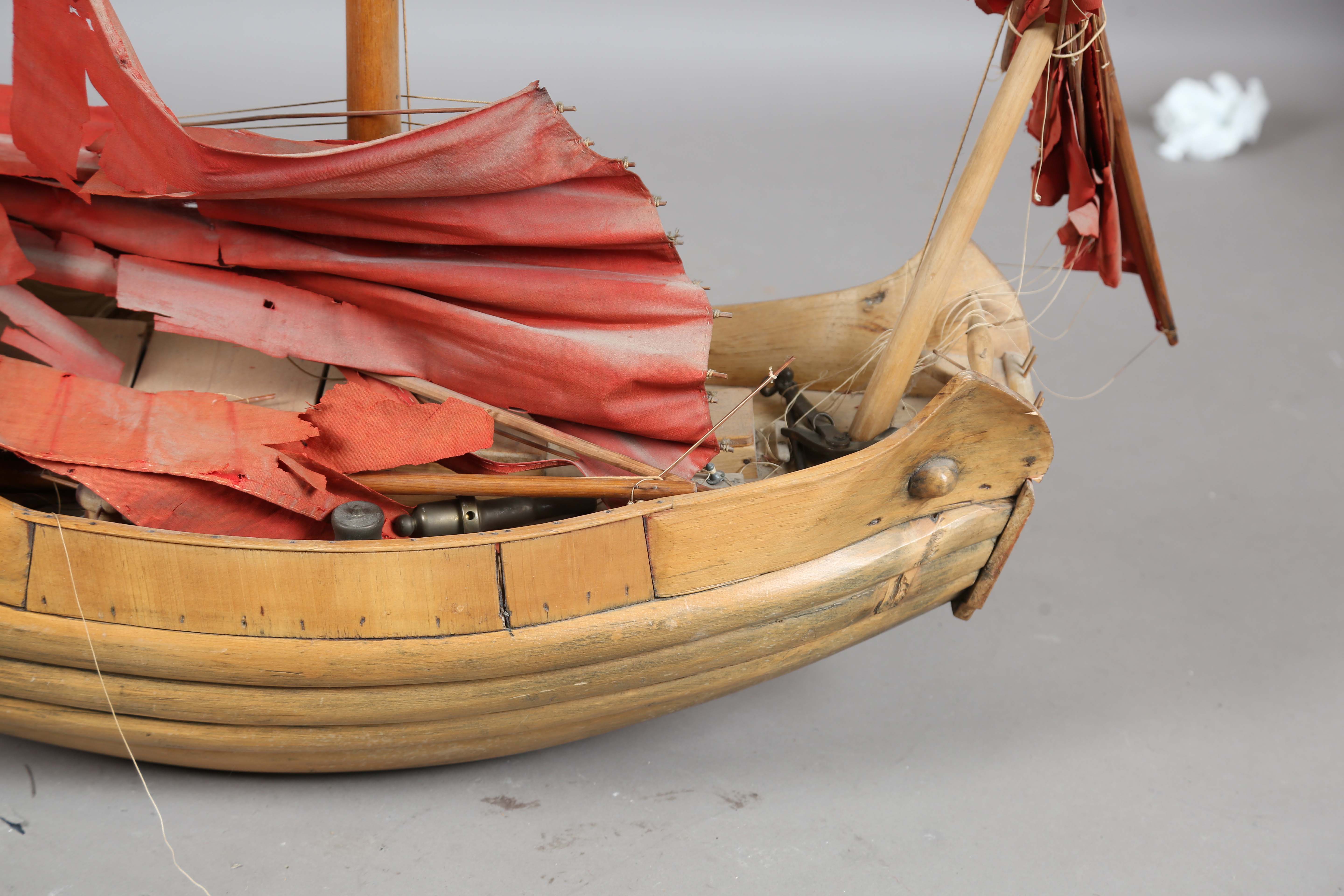 An early 20th century scratch-built softwood model of a boat, detailed with two brass cannons and - Image 8 of 13