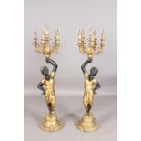 A pair of 20th century composition six-light blackamoor lamps, each figural stem supporting scroll