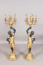 A pair of 20th century composition six-light blackamoor lamps, each figural stem supporting scroll