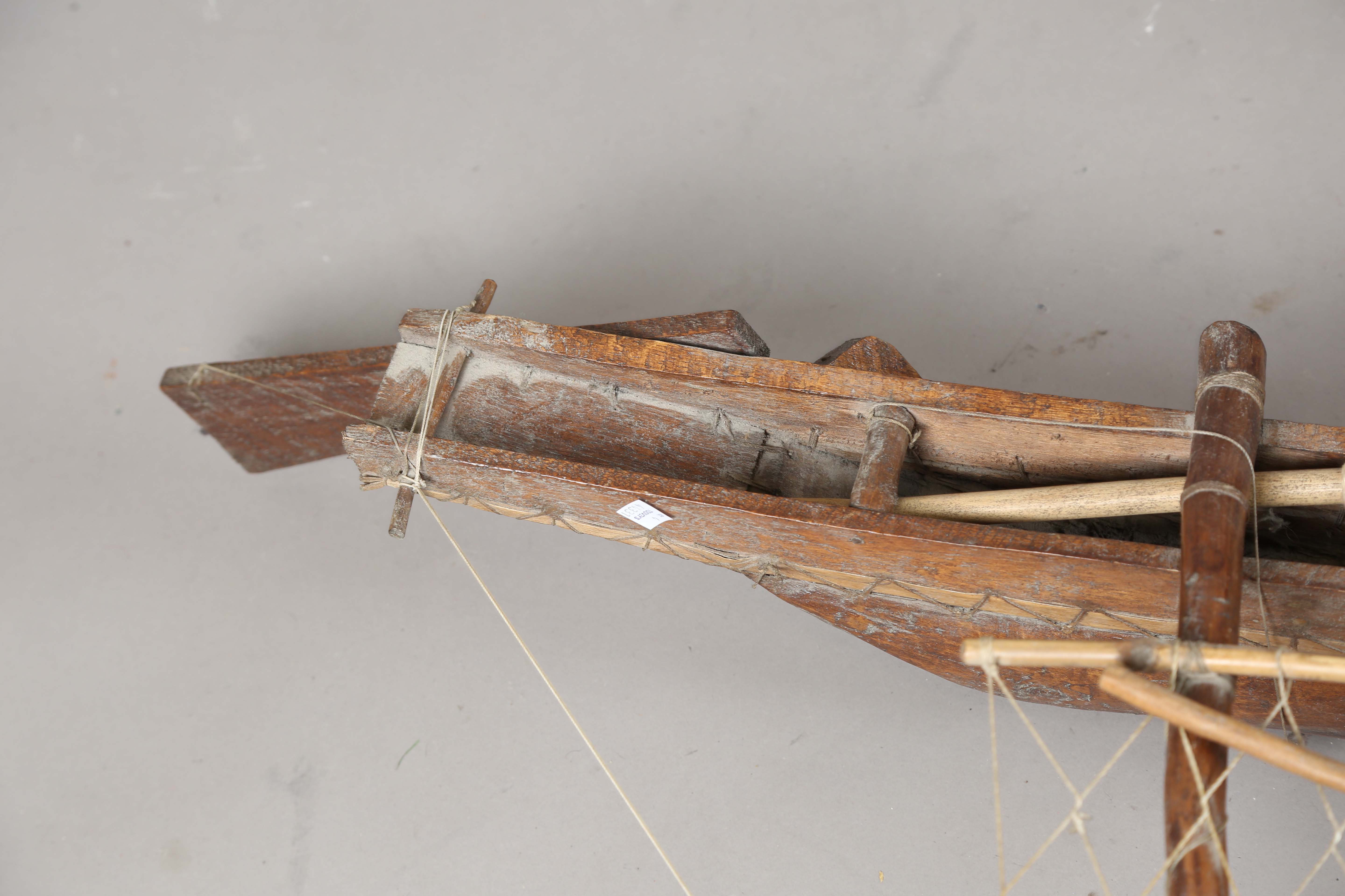 An early 20th century scratch-built softwood model of a boat, detailed with two brass cannons and - Image 4 of 13