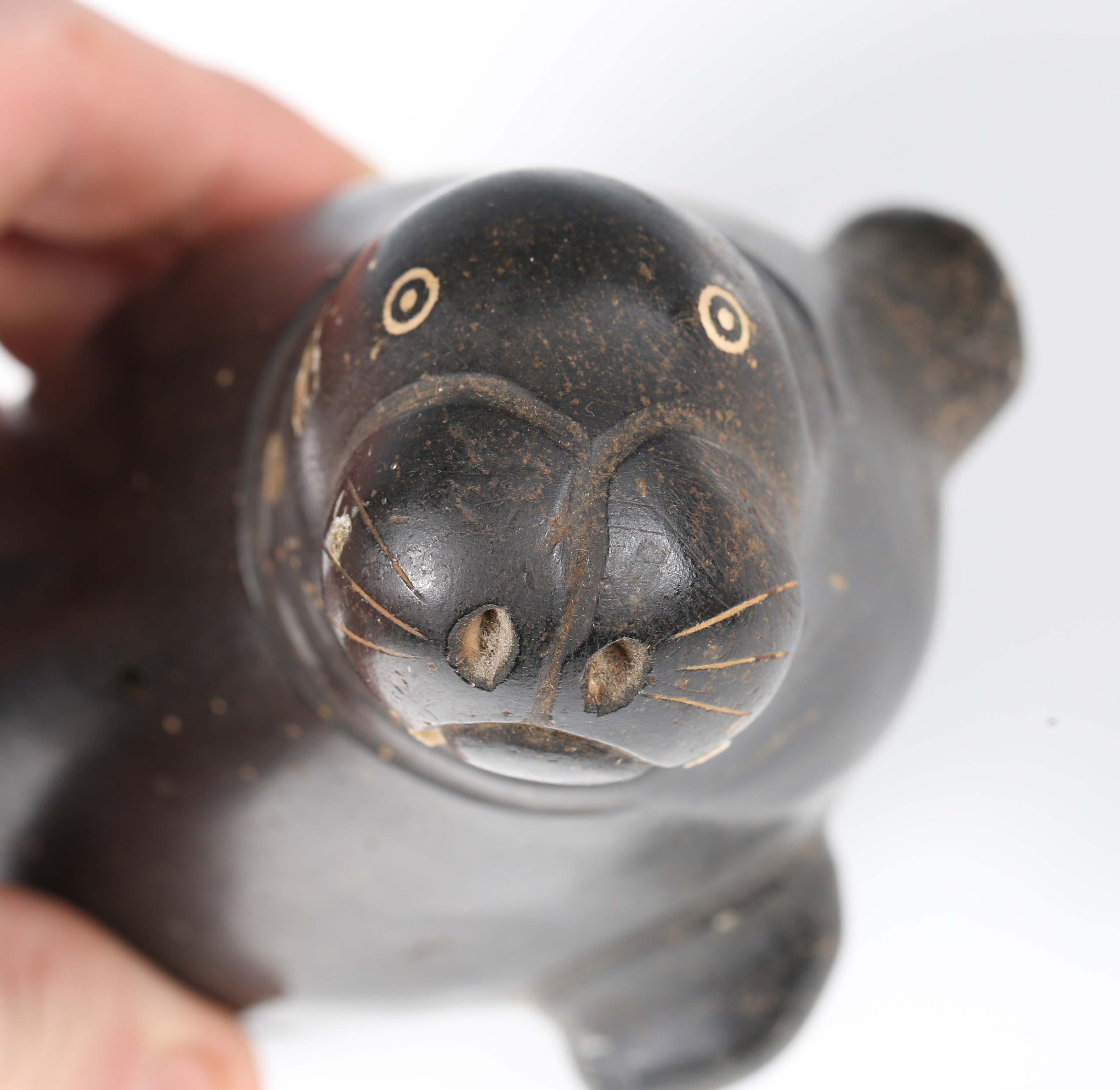 Two Inuit carved black stone figures, one modelled as an Inuit, height 19cm, the other as a - Image 13 of 13