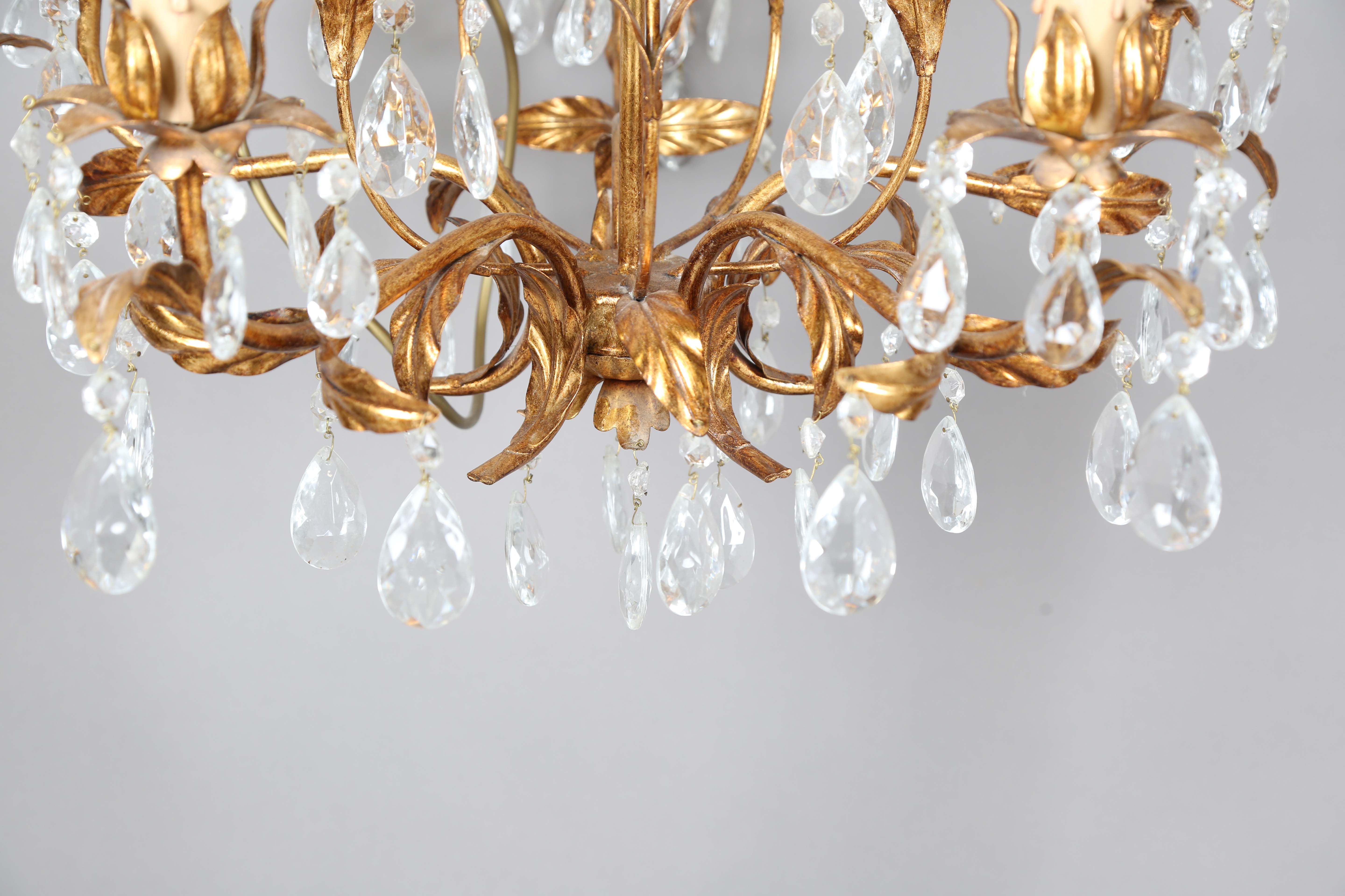 A 20th century gilt metal and cut glass five-light chandelier, height 60cm, width 55cm.Buyer’s - Image 3 of 9