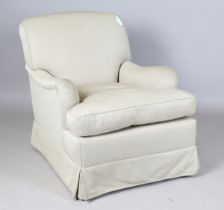 A late 20th century Howard style scroll back armchair, upholstered in taupe fabric, raised on