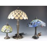 A modern Tiffany style leaded glass and bronzed metal table lamp, height 54cm, together with two