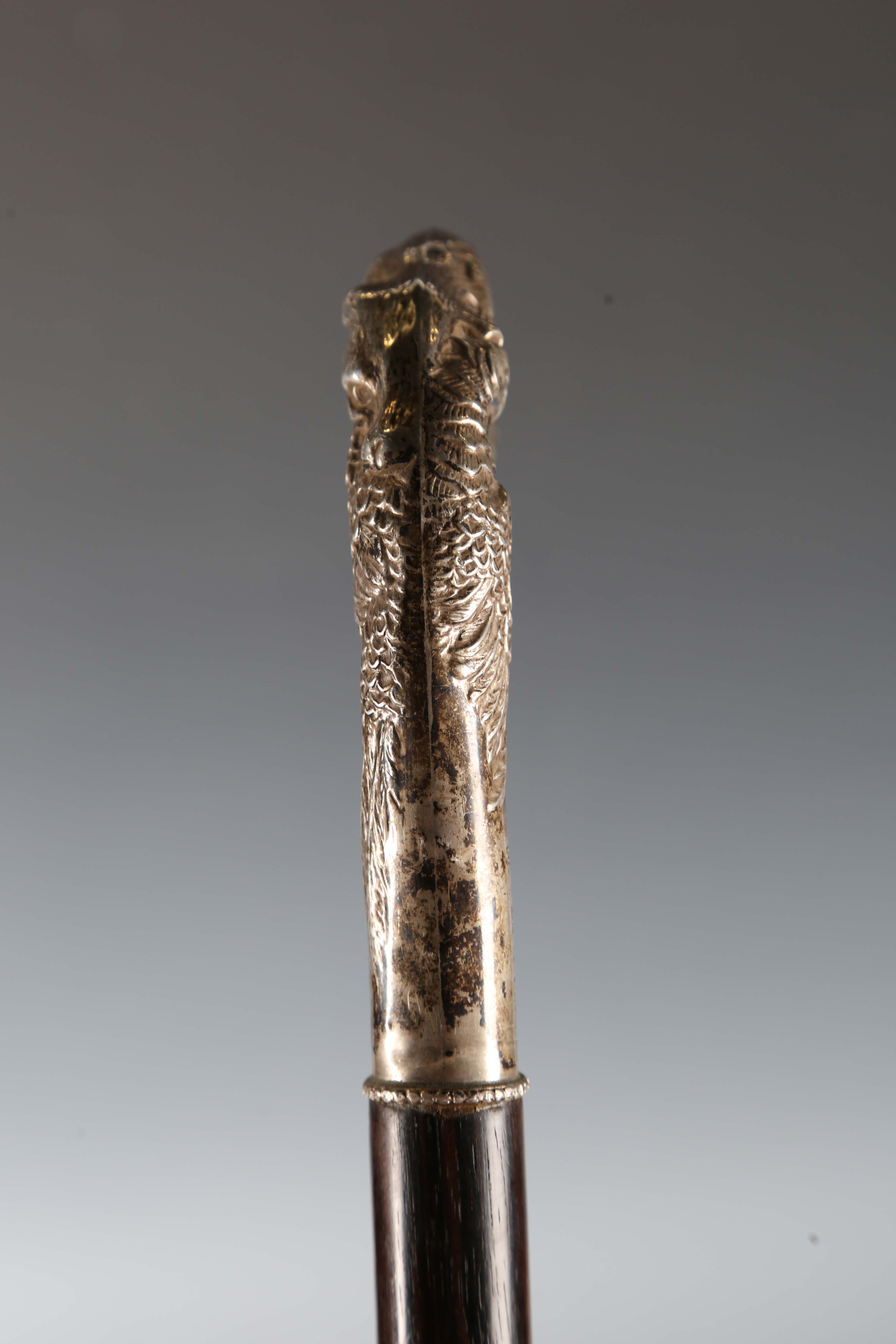 A late 20th century hardwood walking stick, the silver handle decorated in relief with a fox and - Image 9 of 11