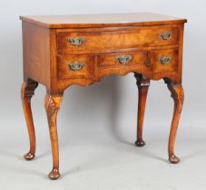 A mid-20th century Queen Anne style walnut side table, on carved cabriole legs, height 78cm, width