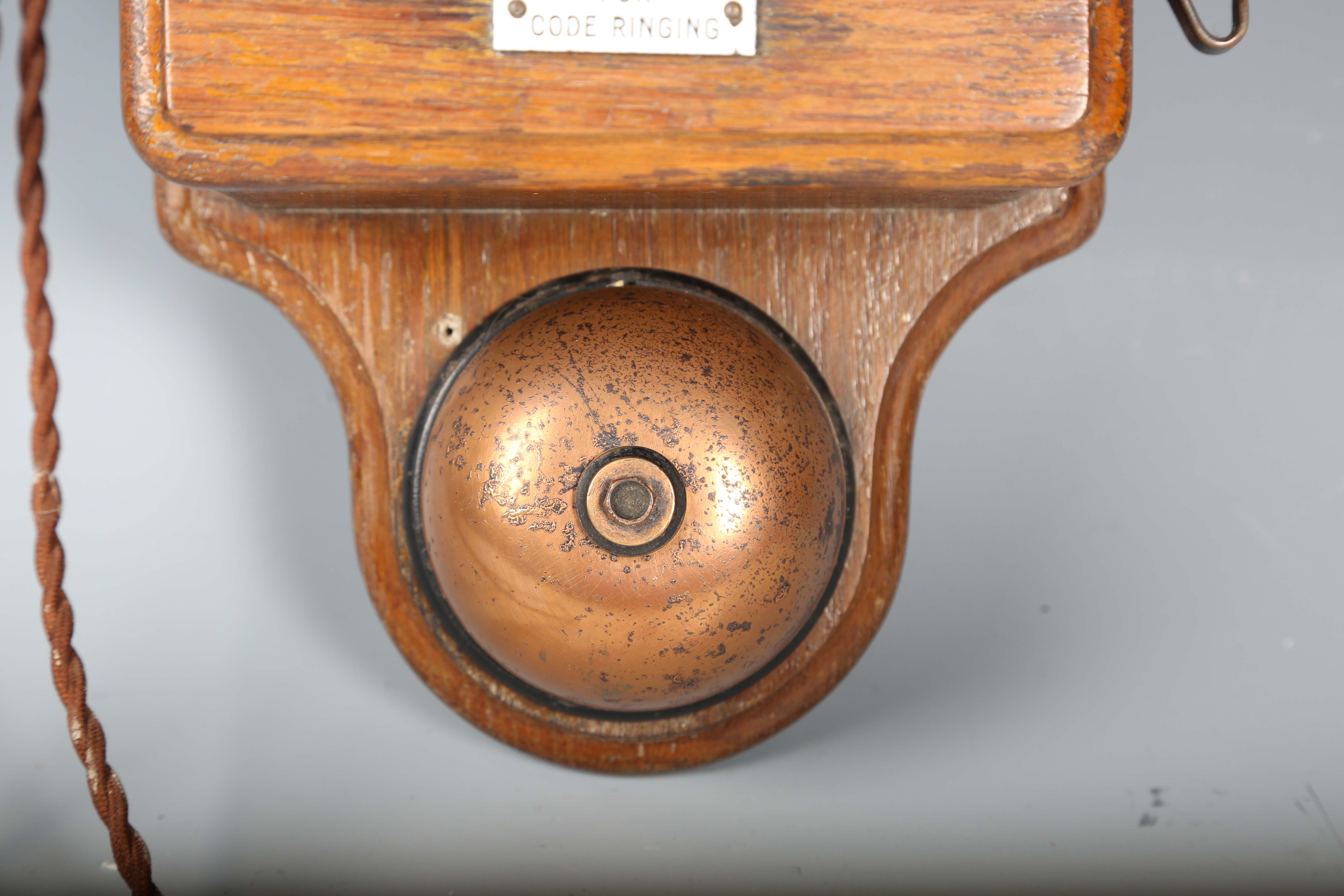 An early 20th century oak cased wall telephone, possibly from a railway, the front with applied - Image 8 of 10