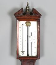 An early 19th century mahogany stick barometer, the silvered dial with Vernier scale and mercury