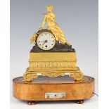An early 19th century French ormolu and brown patinated bronze musical mantel timepiece by Alibert à