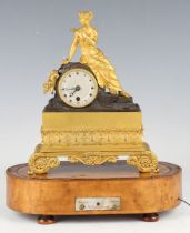 An early 19th century French ormolu and brown patinated bronze musical mantel timepiece by Alibert à