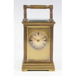 A late 19th/early 20th century brass cased carriage timepiece with eight day movement, the