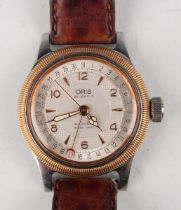 An Oris Automatic steel and gilt metal cased gentleman's calendar wristwatch, Ref. 7463C, with