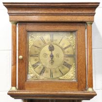 An early 18th century and later oak hood clock with thirty hour movement striking on a bell via an