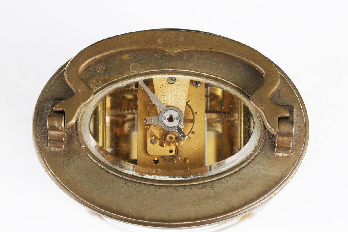 A 20th century brass oval carriage timepiece with eight day movement, the enamelled dial with - Image 2 of 6