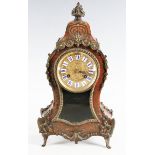 A late 19th century French gilt metal mounted and red tortoiseshell boulle cased mantel clock with