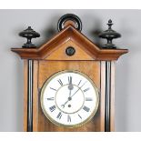 A late 19th century walnut and ebonized Vienna style wall timepiece with single train movement,