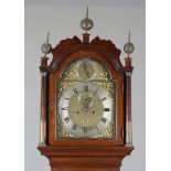 A George III mahogany longcase clock with eight day movement striking on a bell, the 12-inch brass