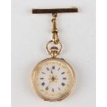 An 18ct gold keyless wind open-faced lady's fob watch with unsigned movement, the enamelled dial