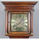 An early 18th century and later oak longcase clock with eight day movement striking on a bell, the