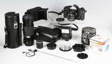 A Canon A-1 camera with 50mm lens, together with various accessories, including a Canon 28mm 1:2.8